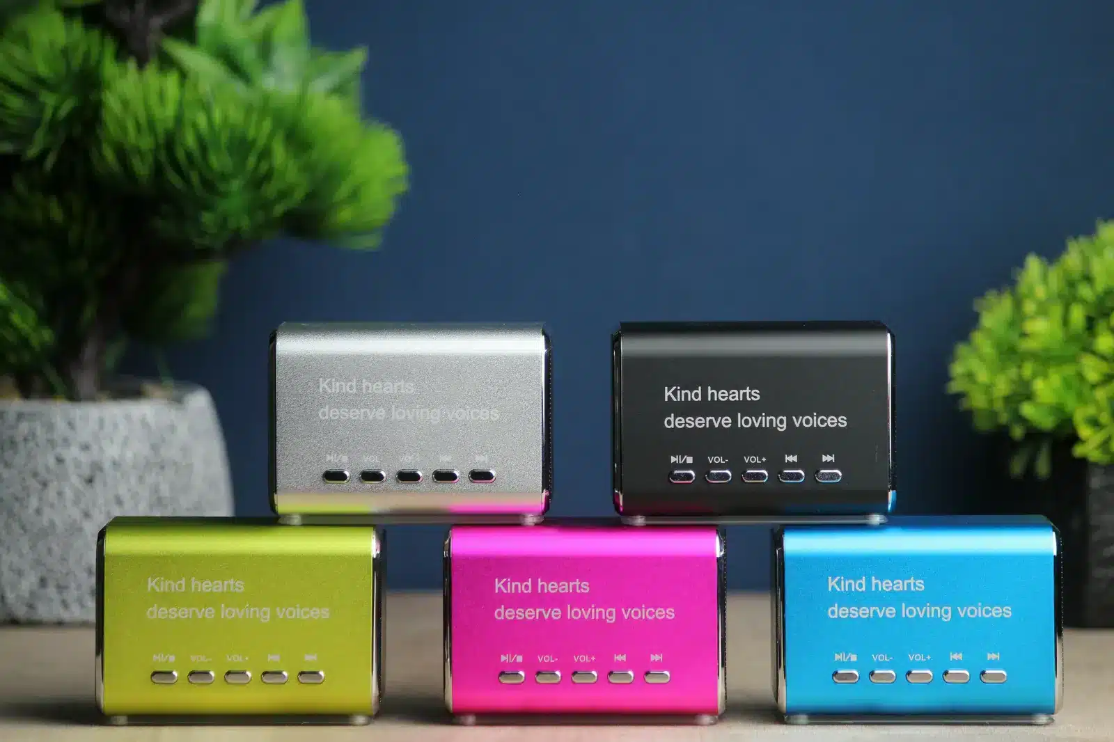 Five colorful LifeOnRecord Keepsake Speakers arranged together