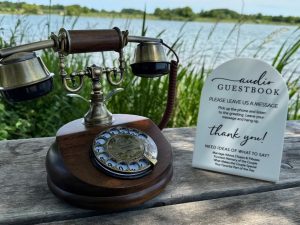 Vintage phone and audio guestbook sign by the lake