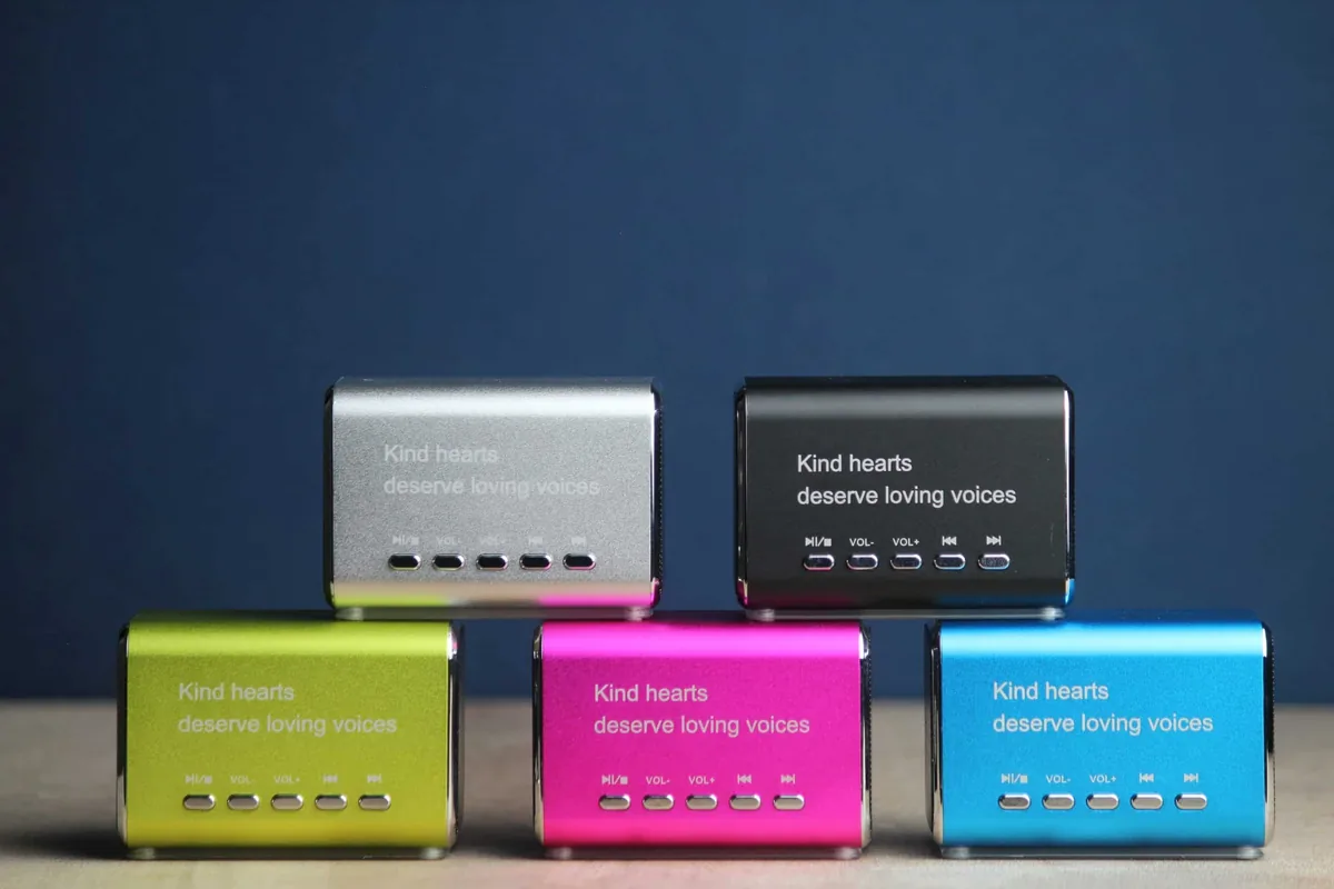 Five LifeOnRecord Keepsake Speakers in silver, black, green, pink, and blue against a navy backdrop.